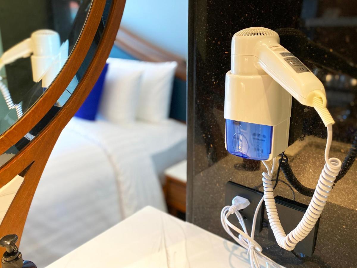 The Oceanic Sportel Phuket - Sha Extra Plus Kültér fotó A hair dryer mounted on a wall